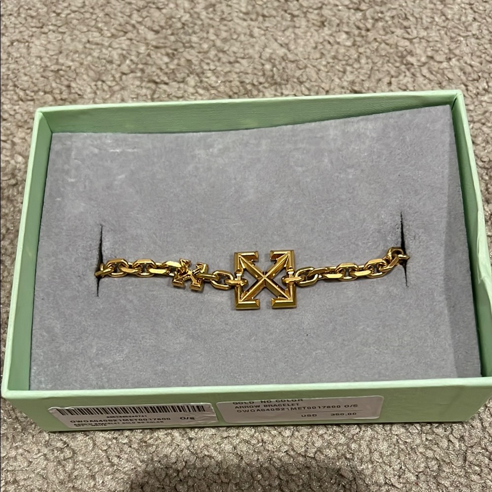 Off White Gold Charm Bracelet with Intricate Detailing